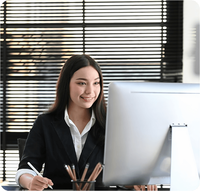 Professional woman working at desk with ClearWork software