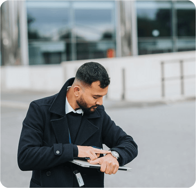 Man using tablet for time and attendance tracking